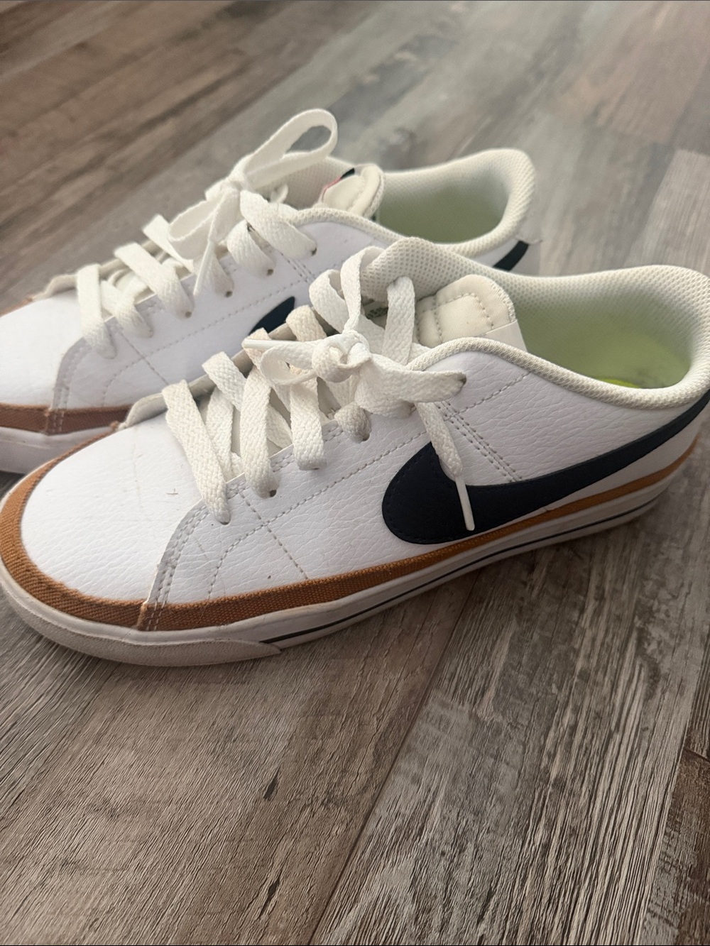 Nike Court Legacy. White Low-Top Sneakers with Black Swoosh and Brown Trim
